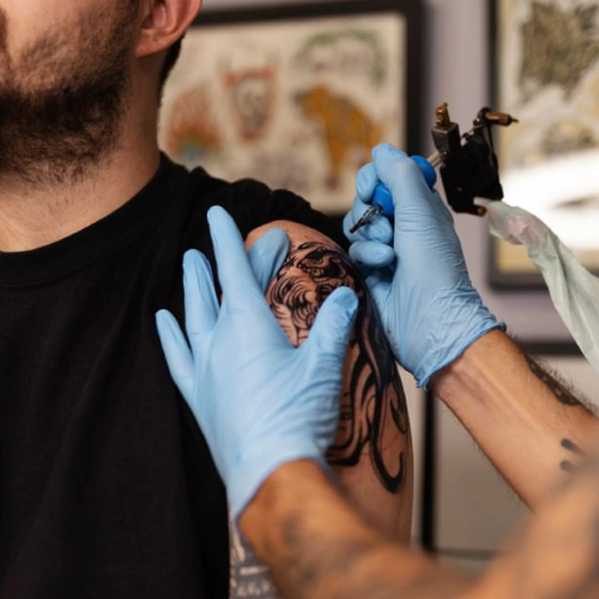 close-up of tattooing process on skin
