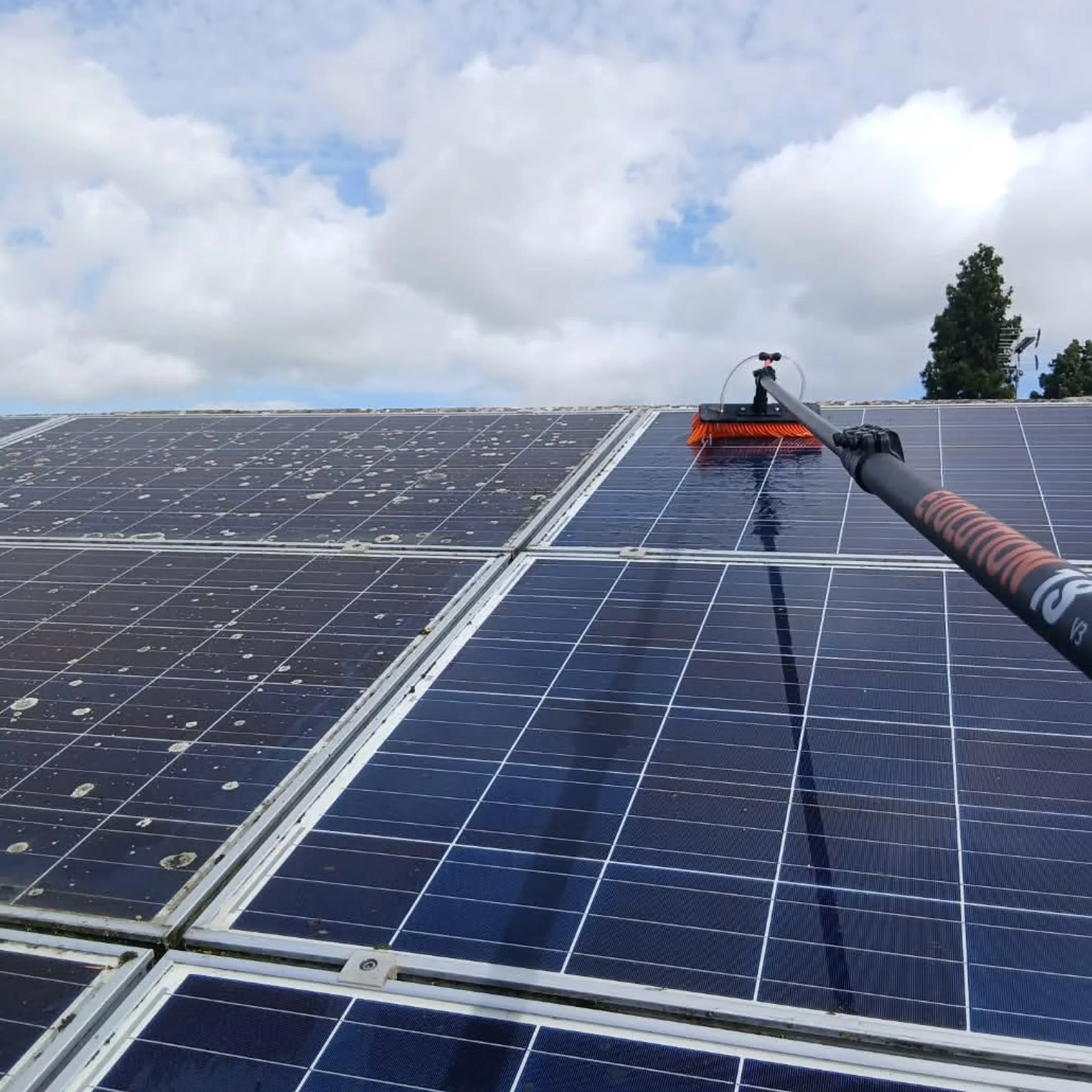 solar panels being cleaned