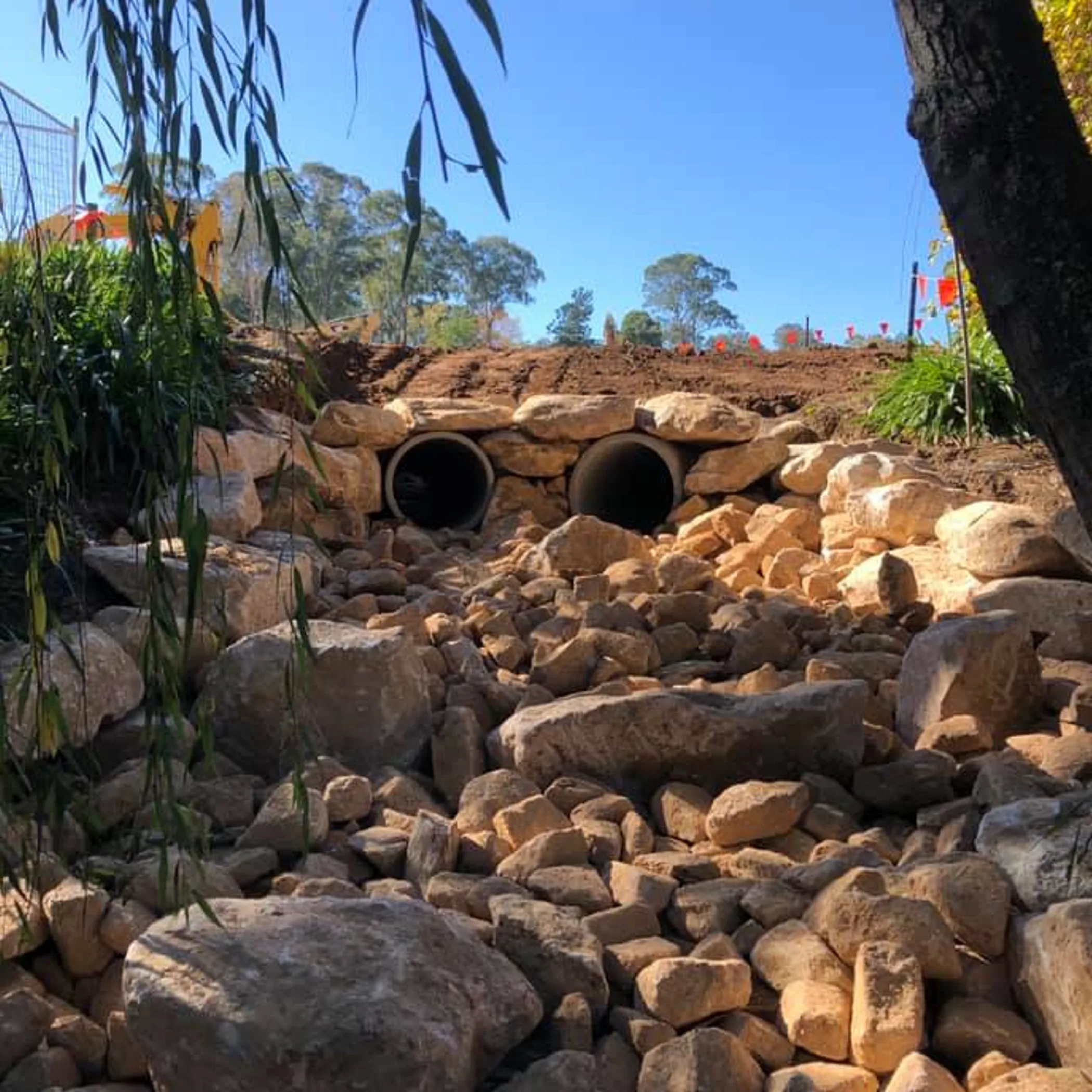 twin stormwater outlets with riprap
